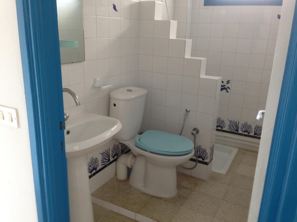 Shower, free toiletries, hair dryer, slippers