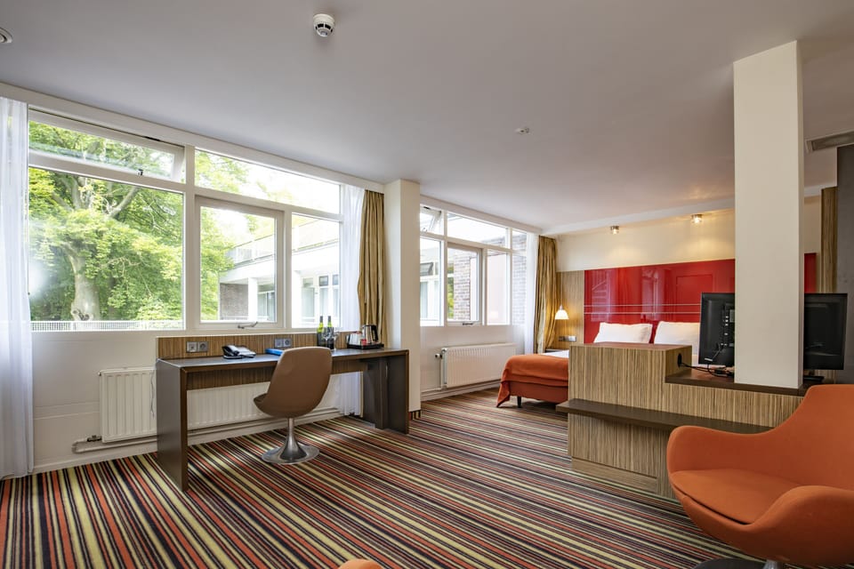 Junior Suite | Desk, blackout drapes, iron/ironing board, free WiFi
