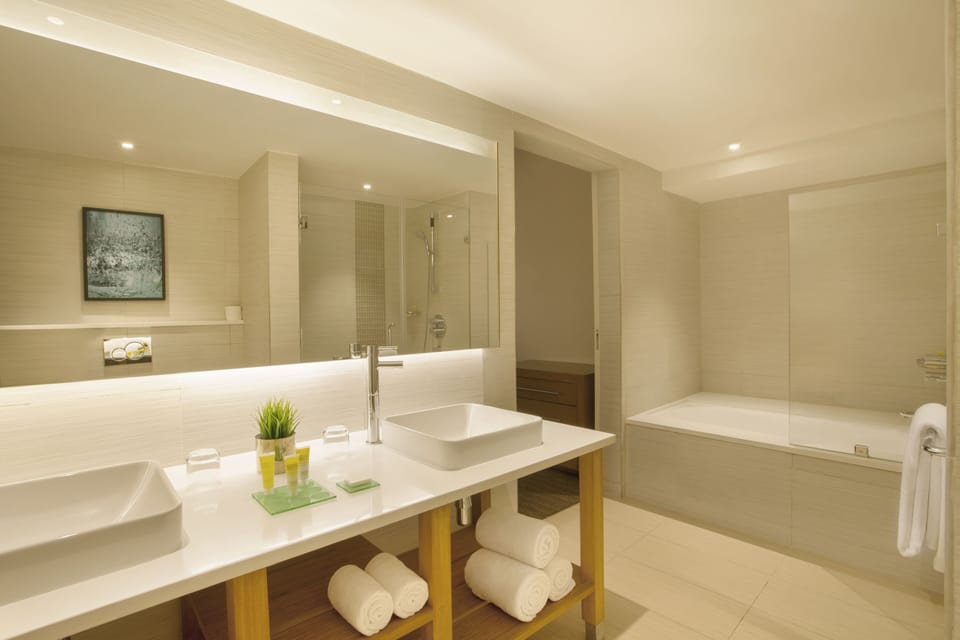 Designer toiletries, hair dryer, bathrobes, towels