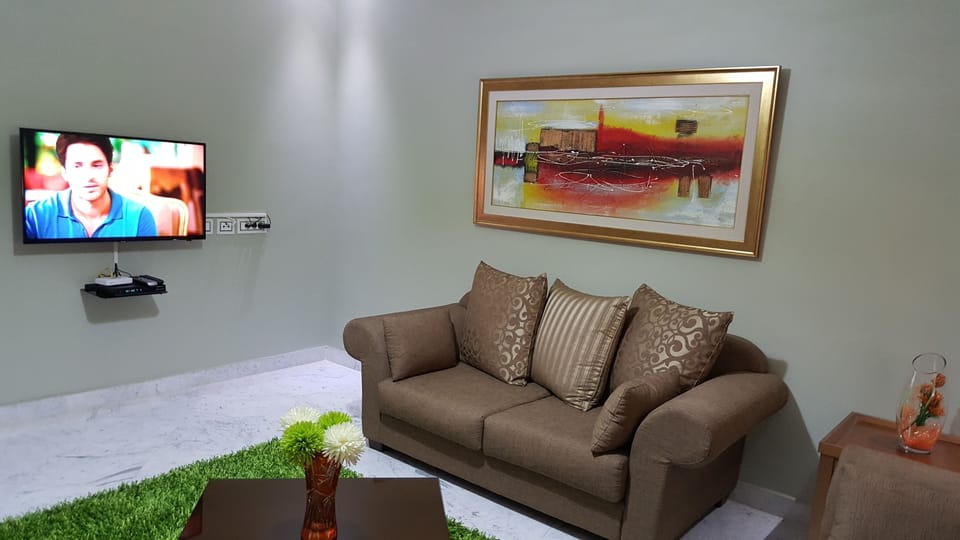 Apartment, 1 Bedroom | Living room | 40-inch flat-screen TV with satellite channels, TV