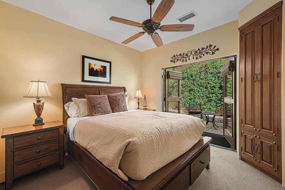 Guest Bedroom Three has Queen Bed and Furnished Patio