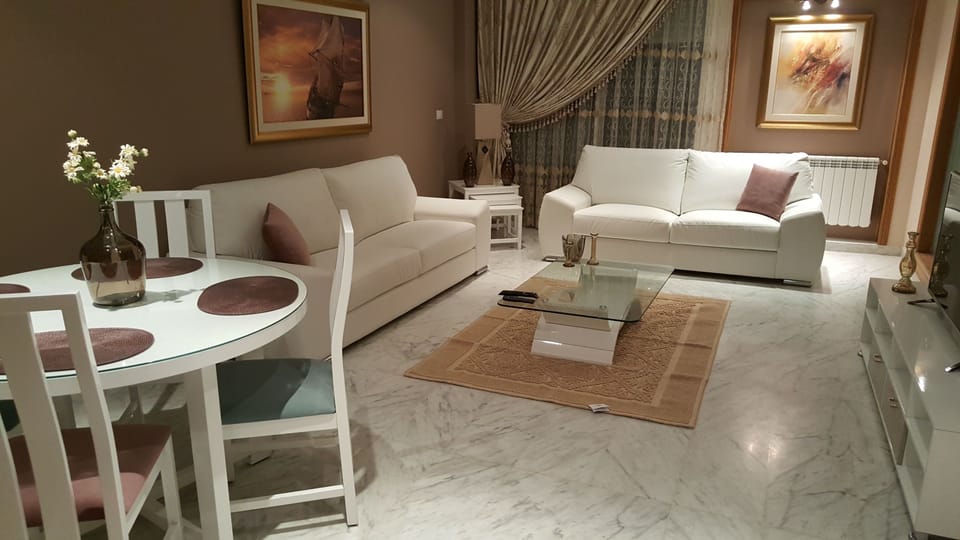 Apartment, 2 Bedrooms | Living room | 42-inch flat-screen TV with satellite channels, TV