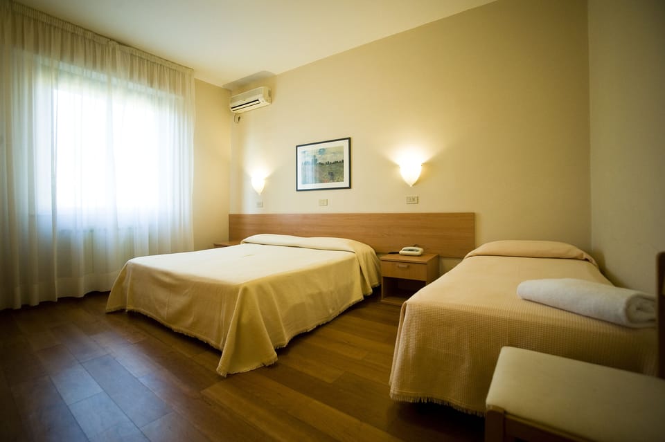 Triple Room | Minibar, in-room safe, desk, free WiFi