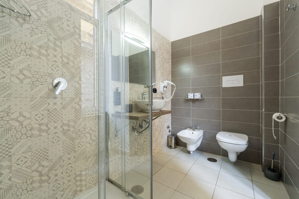 Designer toiletries, hair dryer, towels, soap