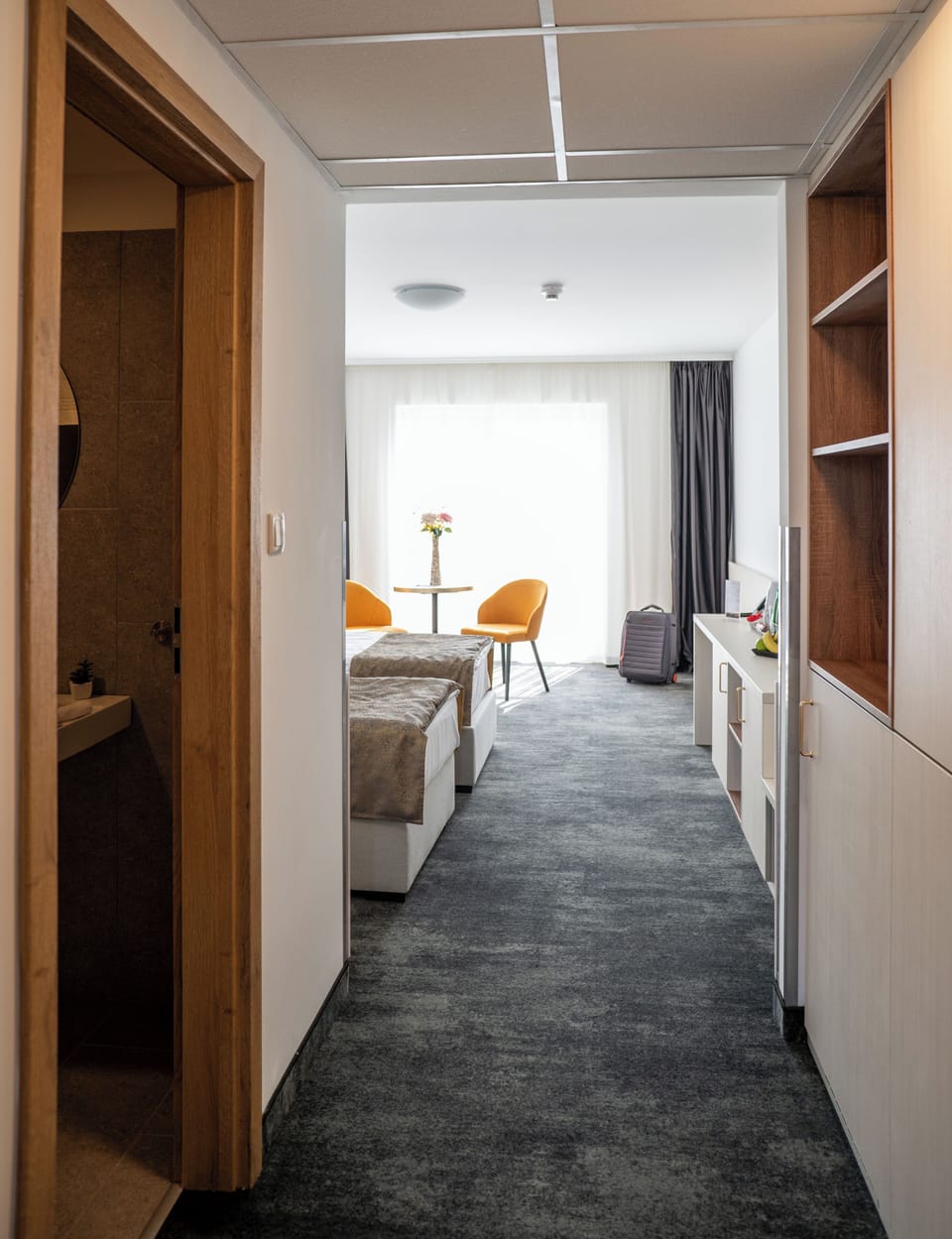 Deluxe Double or Twin Room | Minibar, in-room safe, blackout drapes, iron/ironing board