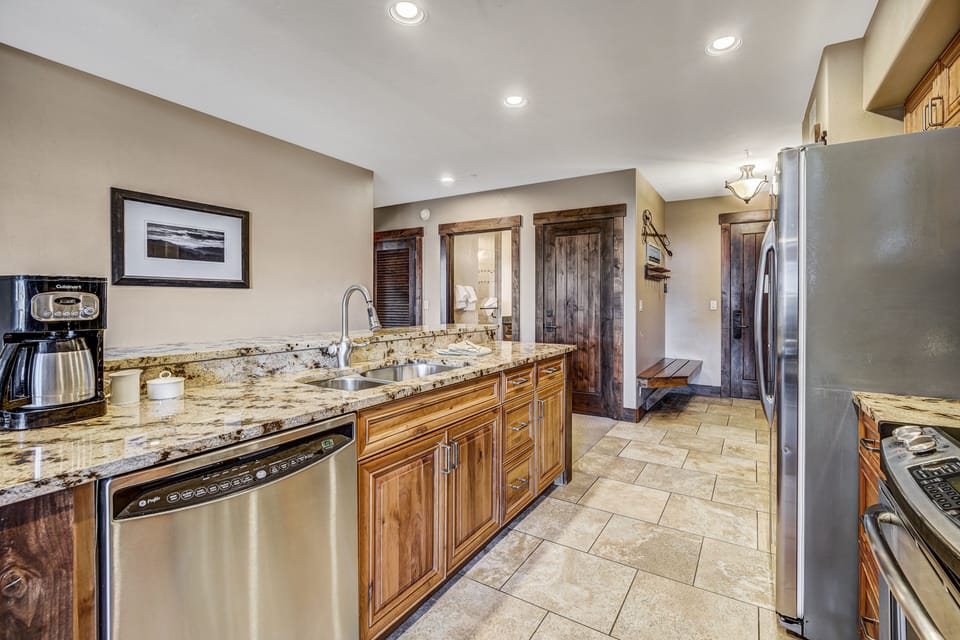 Condo, 2 Bedrooms | Private kitchen | Full-size fridge, microwave, oven, stovetop