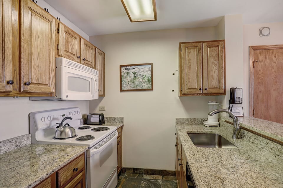 Condo, 1 Bedroom | Private kitchen | Full-size fridge, microwave, oven, stovetop