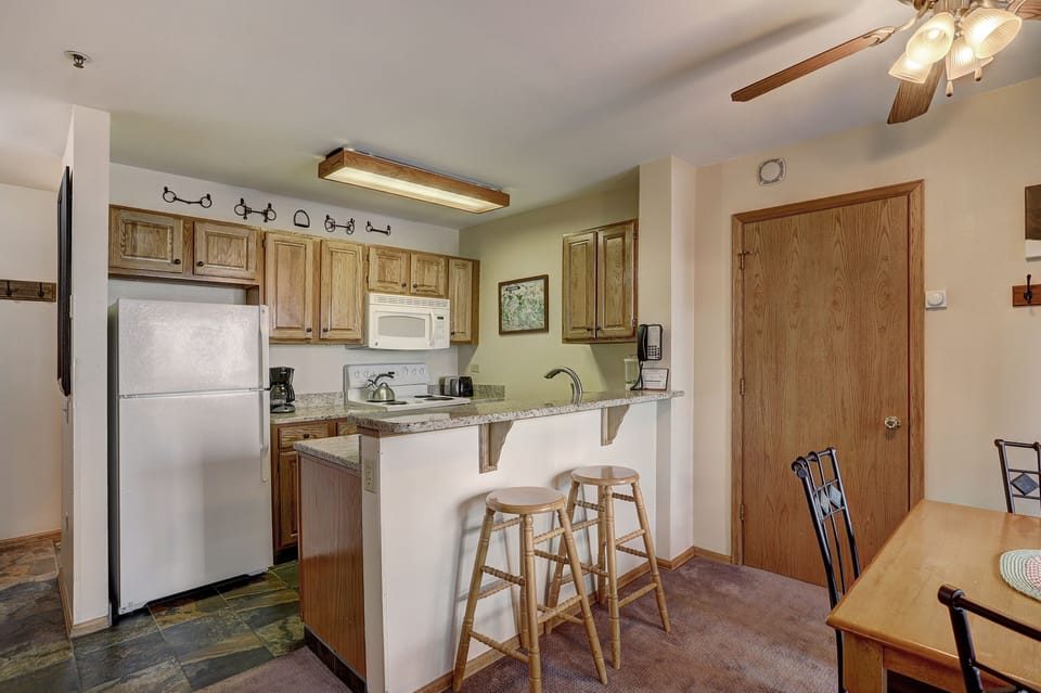 Condo, 1 Bedroom | Private kitchen | Full-size fridge, microwave, oven, stovetop
