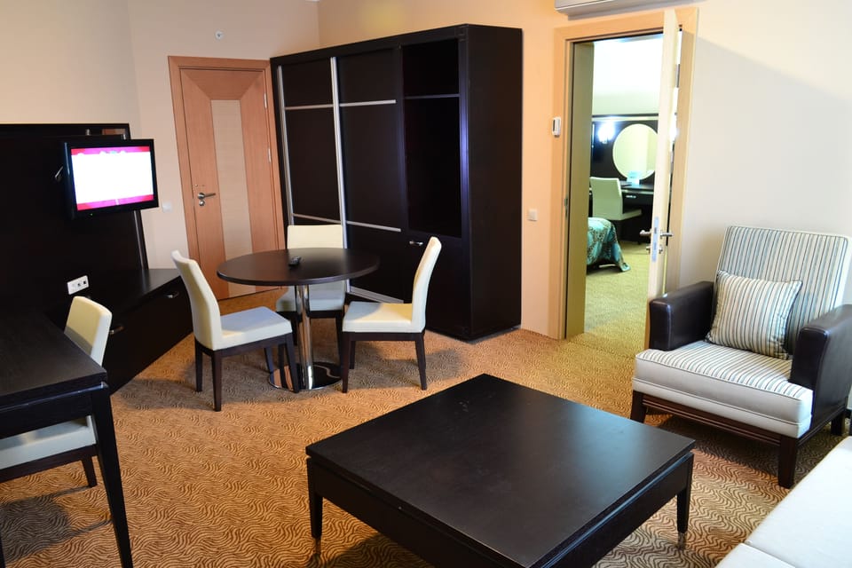 Deluxe Triple Room | Living room | LCD TV