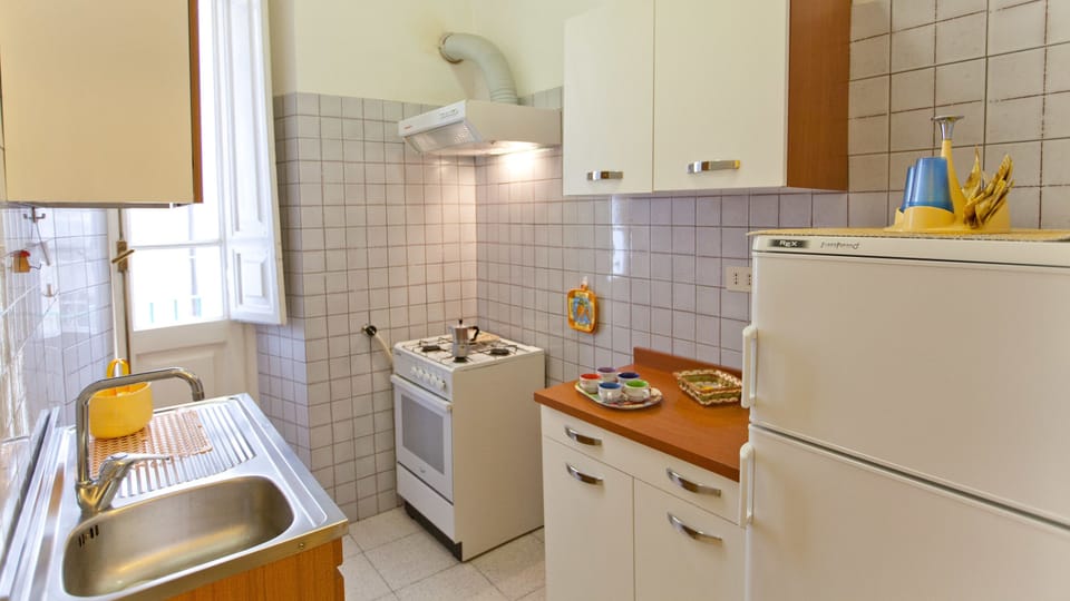 Apartment, 3 Bedrooms | Private kitchen | Full-size fridge, oven, stovetop, espresso maker