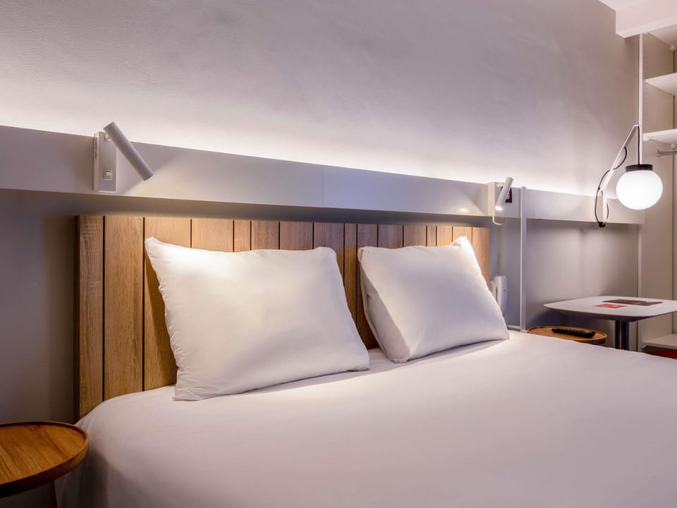Premium bedding, desk, laptop workspace, blackout drapes