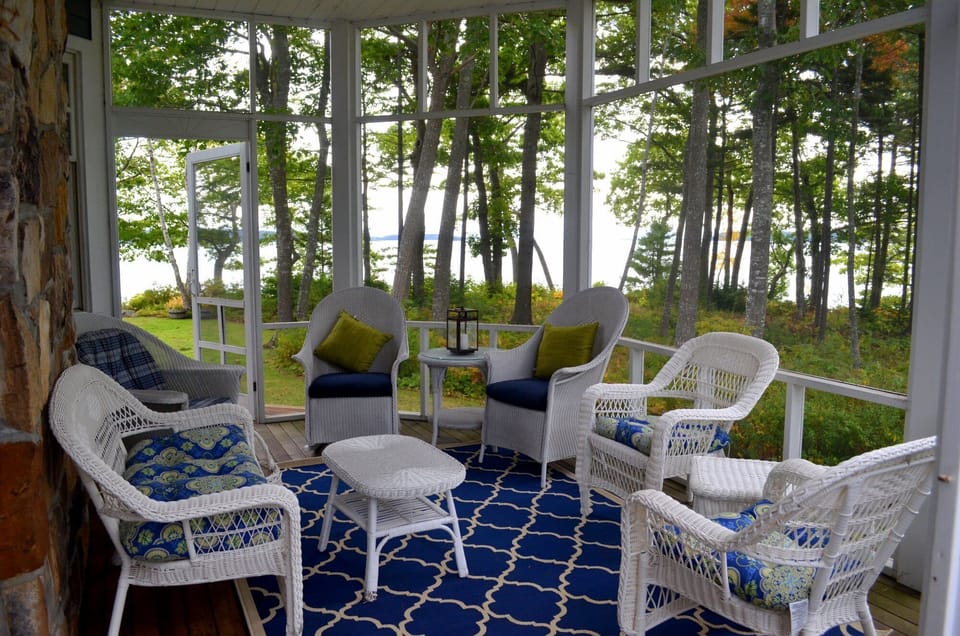 Screened porch is perfect for cocktails at the end of the day.
