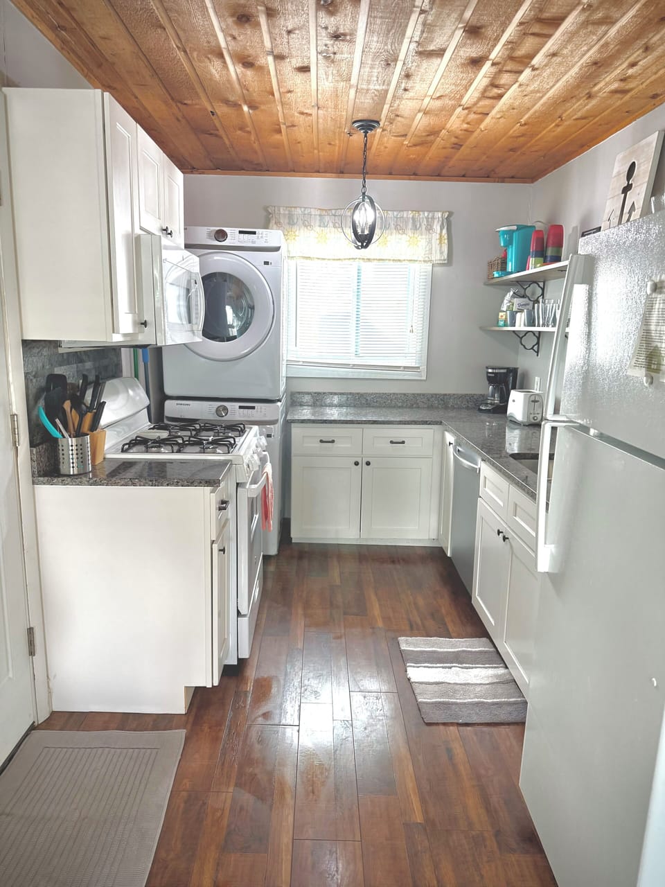 Kitchen has new stack washer and dryer