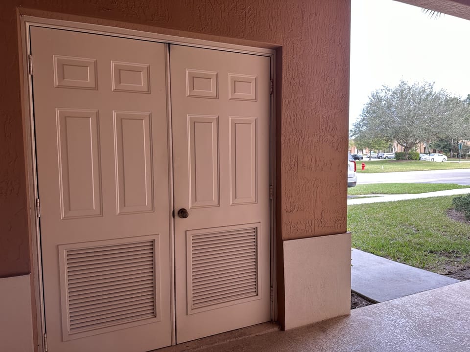 Convenient laundry behind louvered doors