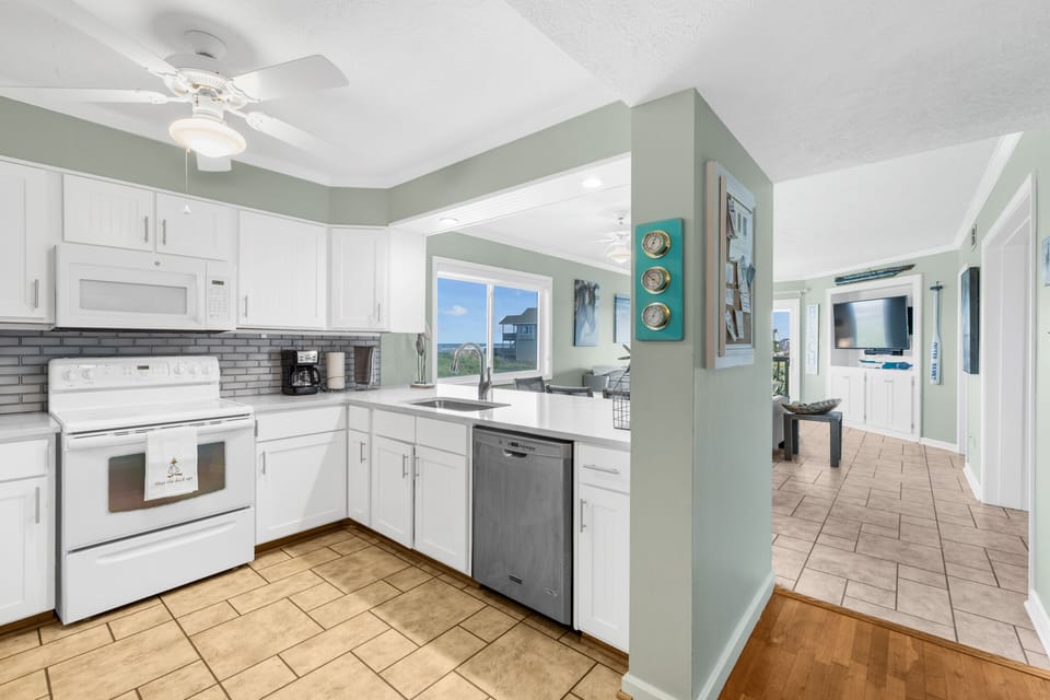 Fully stocked kitchen and open concept for conversing with family and friends