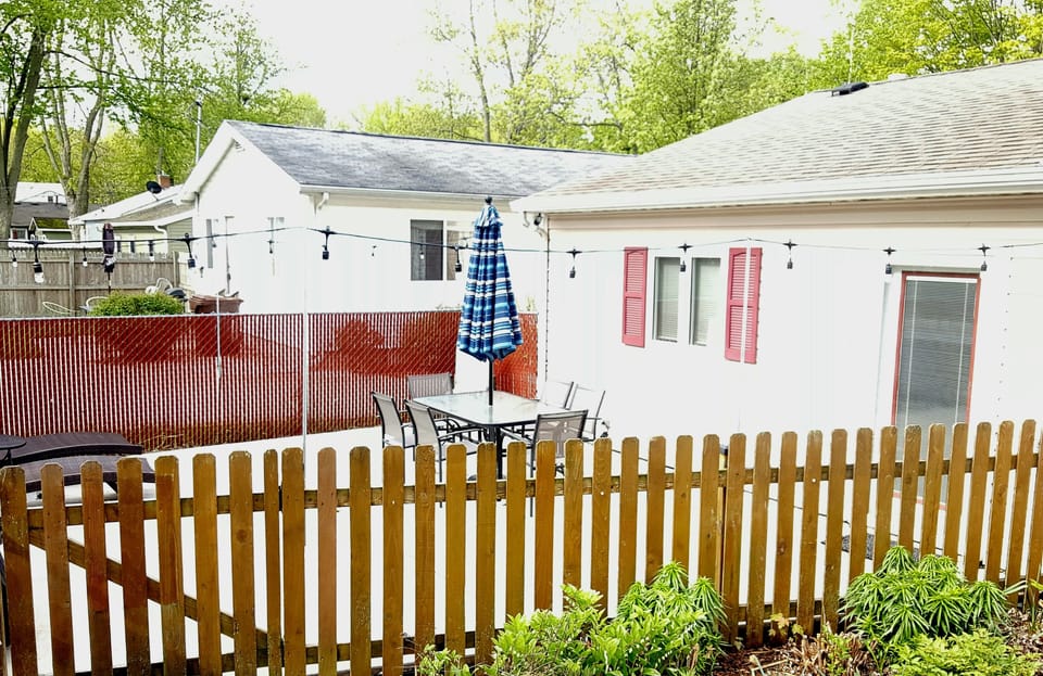 Fenced in patio with lights 