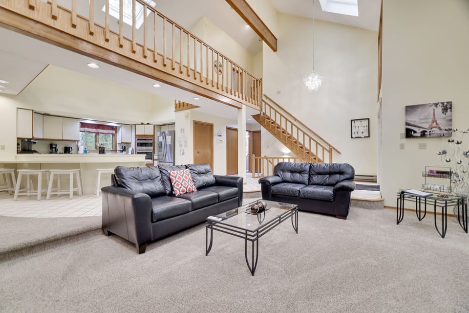 Huge, open concept living room. Plenty of seating, 72 inch TV, wood fireplace