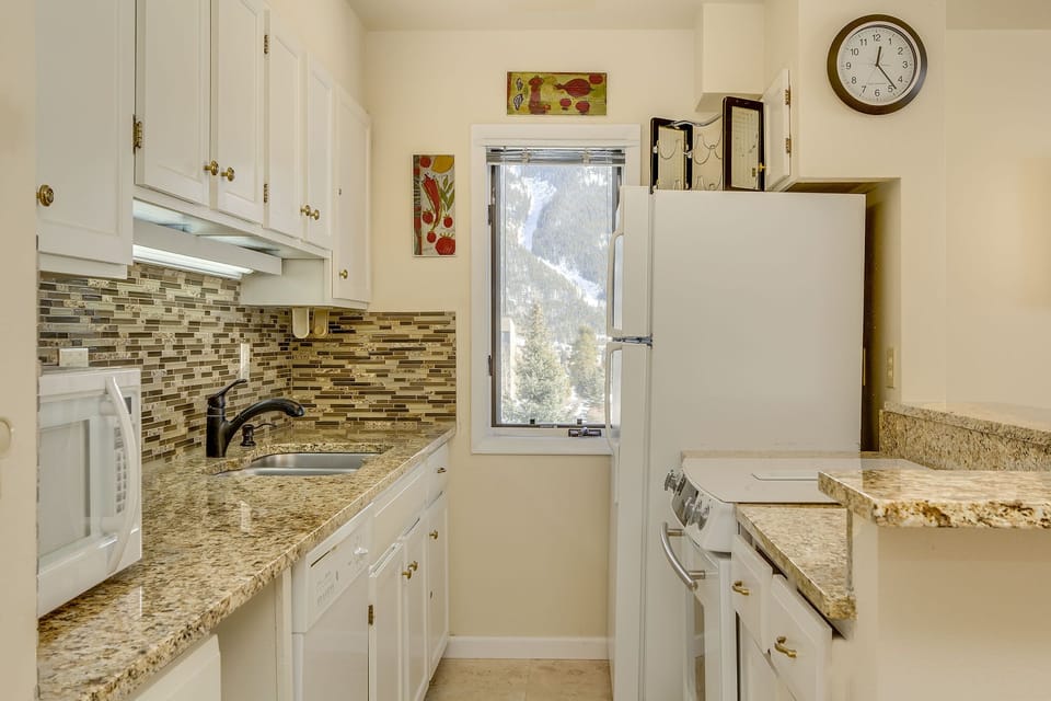 Stainless steel sink and lots of counter space in the well-equipped kitchen.