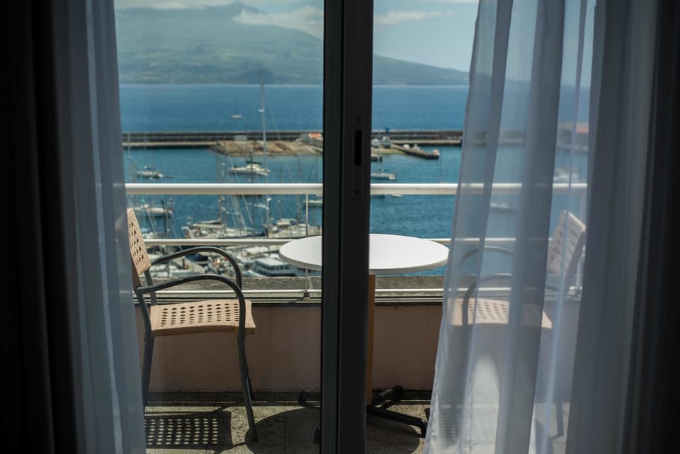 Executive Twin Room, Sea View | Minibar, in-room safe, desk, free WiFi