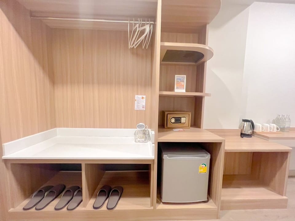 Family Triple Room, Multiple Beds | Free minibar items, in-room safe, individually decorated, desk
