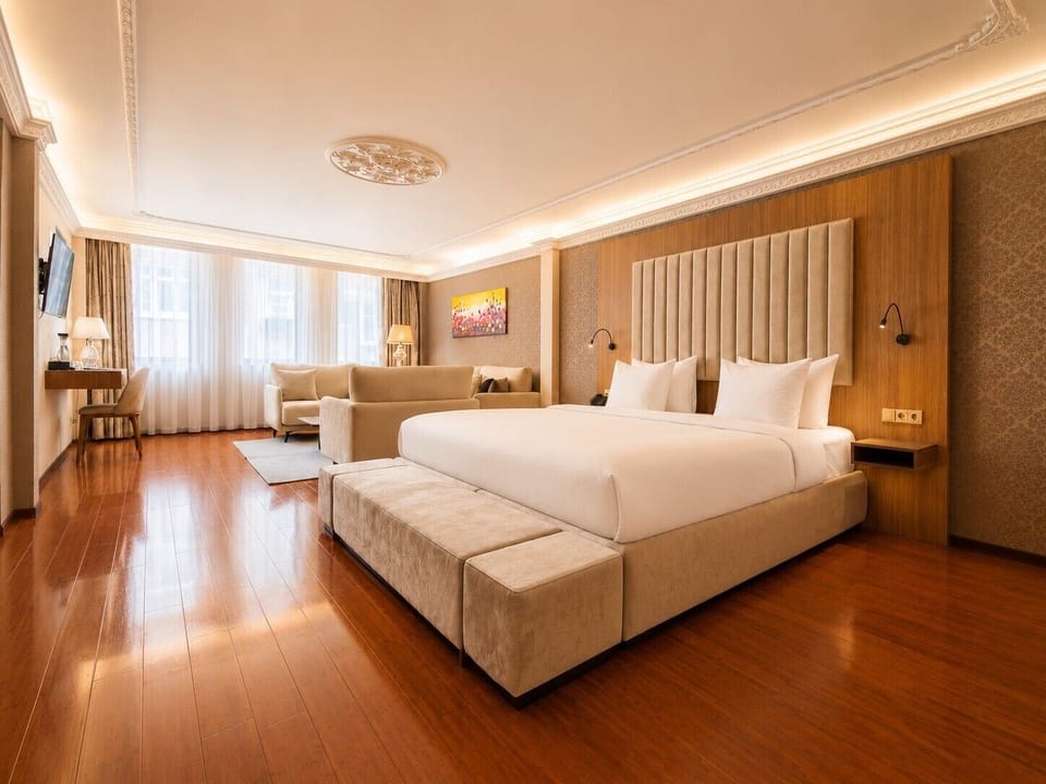 Luxury Suite, 1 King Bed, Bathtub | In-room safe, desk, laptop workspace, iron/ironing board