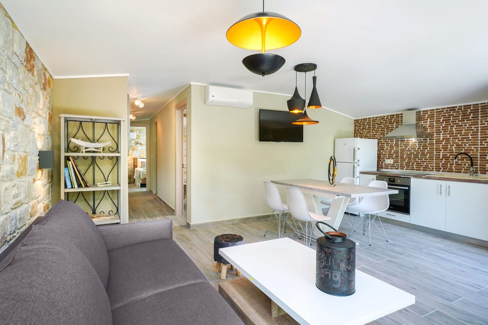 Deluxe Loft, 2 Bedrooms | Living area | 24-inch flat-screen TV with satellite channels, DVD player, toys