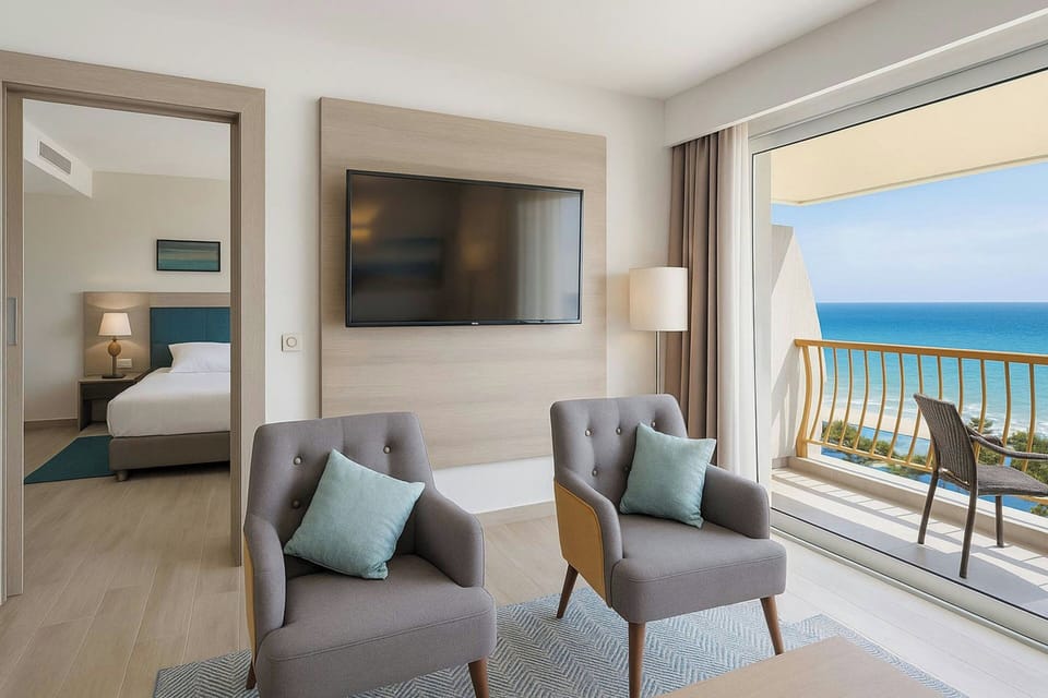 Executive Suite, 1 Bedroom, Balcony, Partial Sea View | Egyptian cotton sheets, premium bedding, minibar, in-room safe