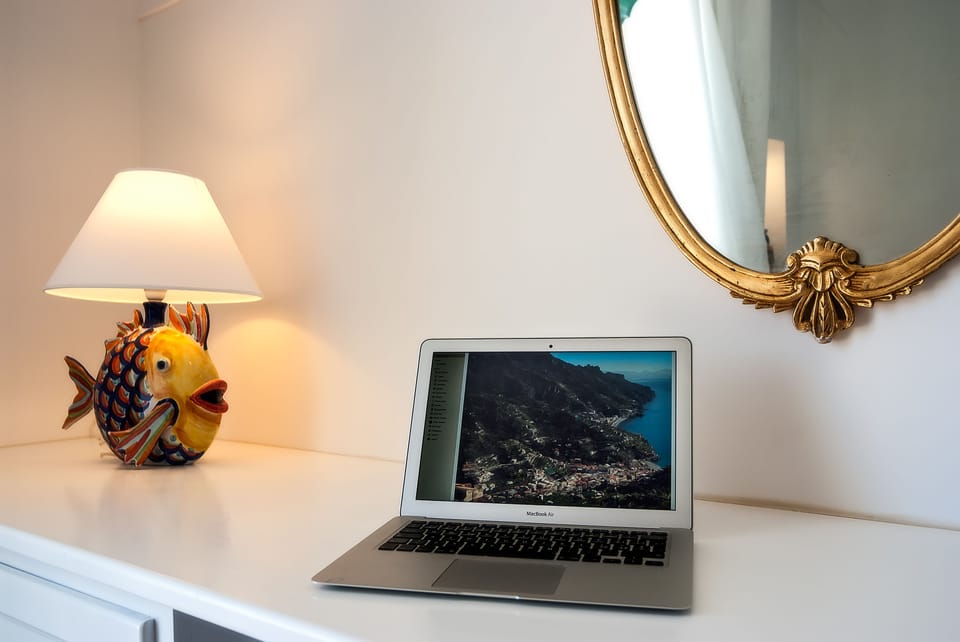 Deluxe Double Room, Sea View | Minibar, in-room safe, individually decorated, individually furnished