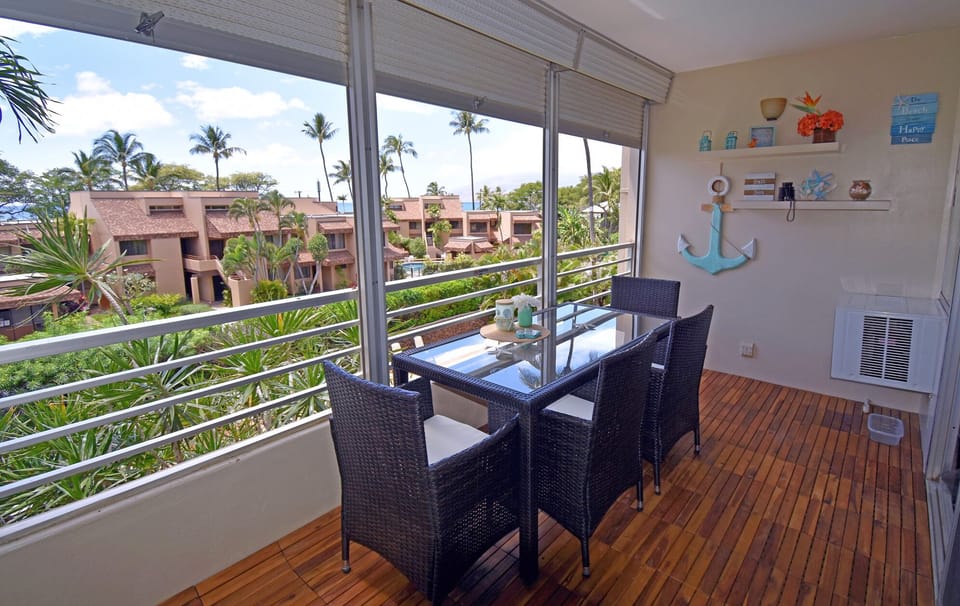 With one of the larger sized lanai! New acacia wood flooring and patio set!