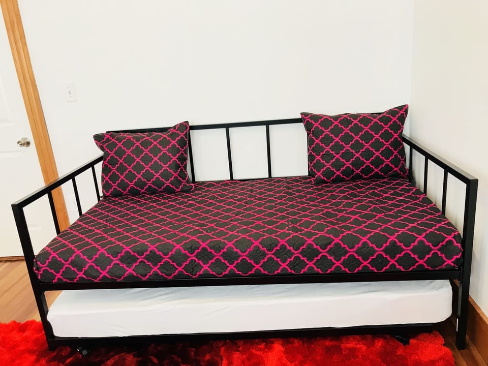 Dining room has a daybed with trundle for extra guests