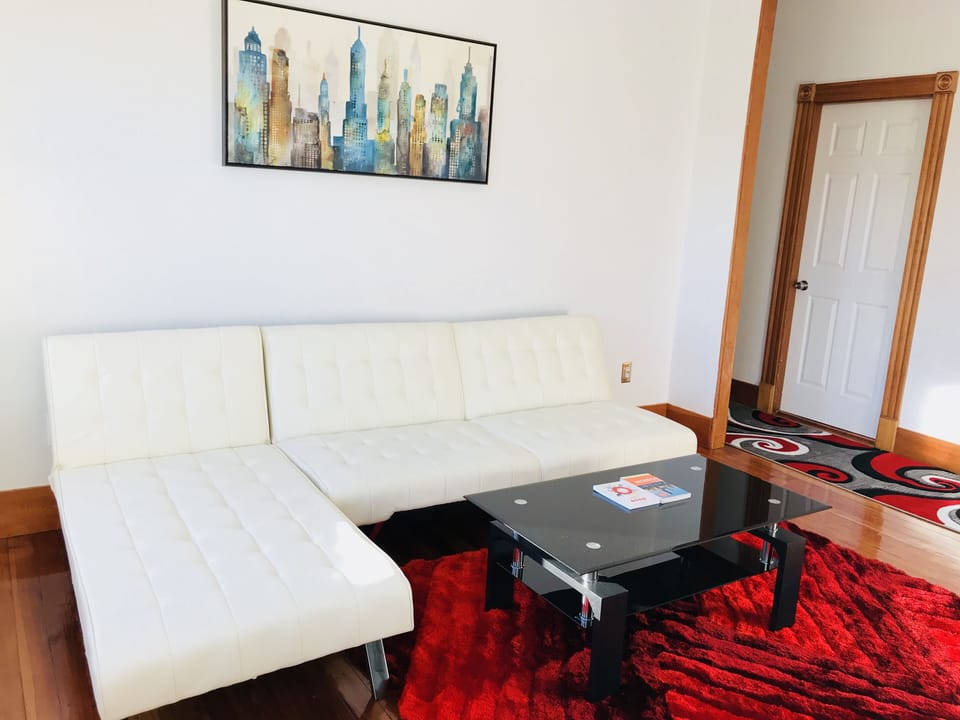 Socialize at the spacious living room with 2 sofa-beds, 55’ Plazma TV and cozy f