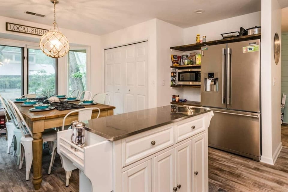 French door fridge with two icemakers, abundance of cabinetry for storage