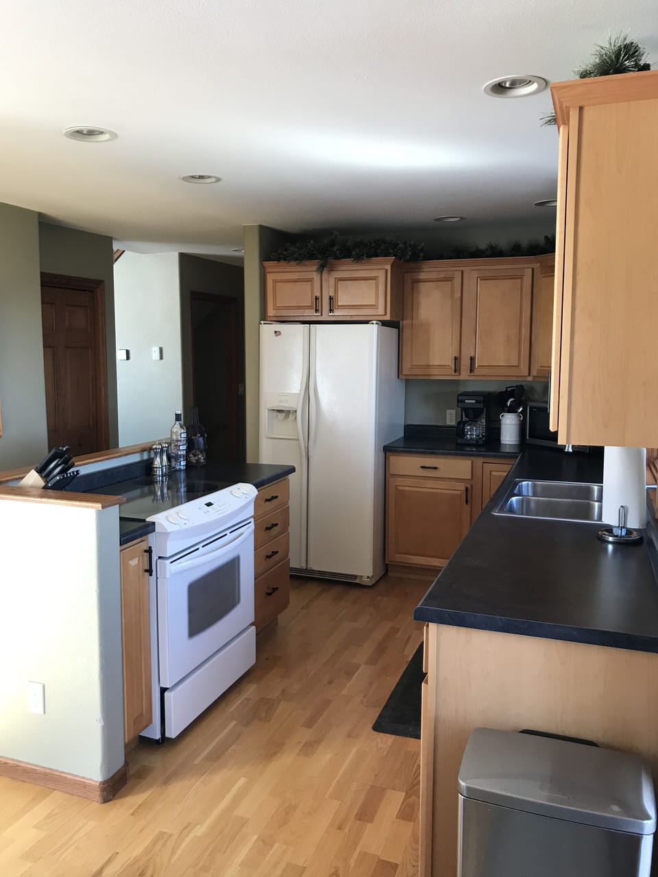 Open kitchen with new countertops
Stove, microwave, fridge and dishwasher
