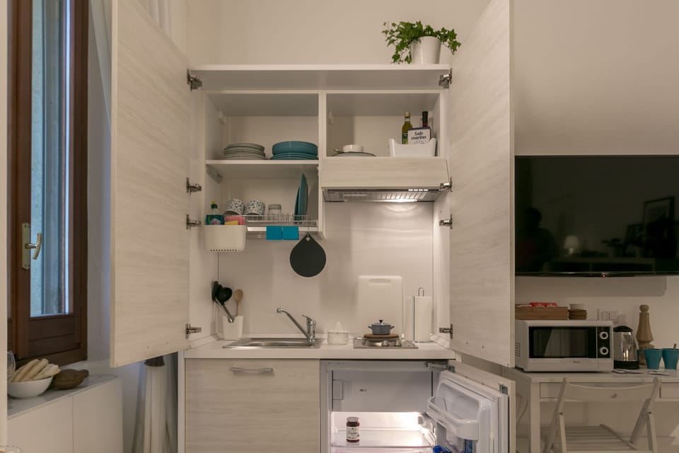 Apartment, 1 Bedroom | Private kitchenette | Fridge, microwave, stovetop, coffee/tea maker