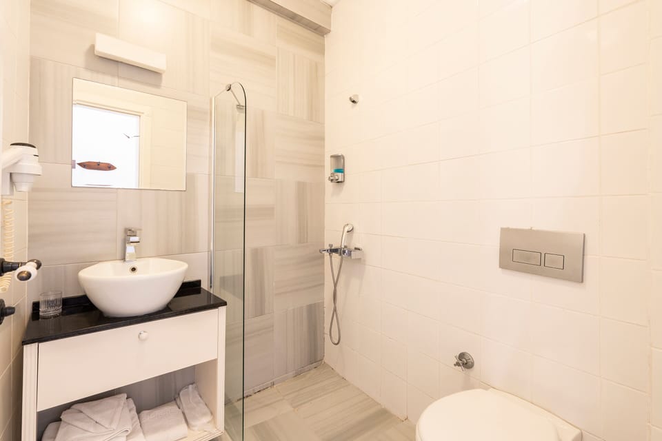 Shower, free toiletries, hair dryer, slippers