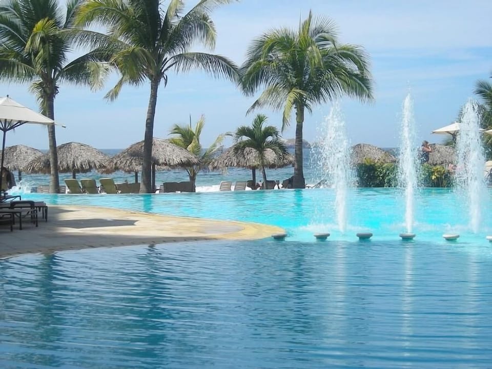 Outdoor pool, open 9 AM to 9 PM, pool umbrellas, sun loungers