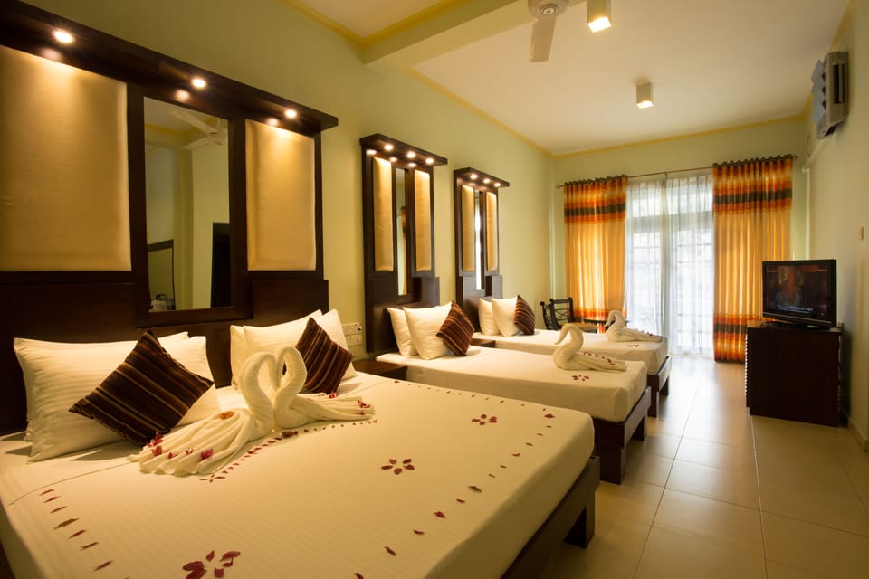 Family Suite | Minibar, in-room safe, desk, iron/ironing board (on request)
