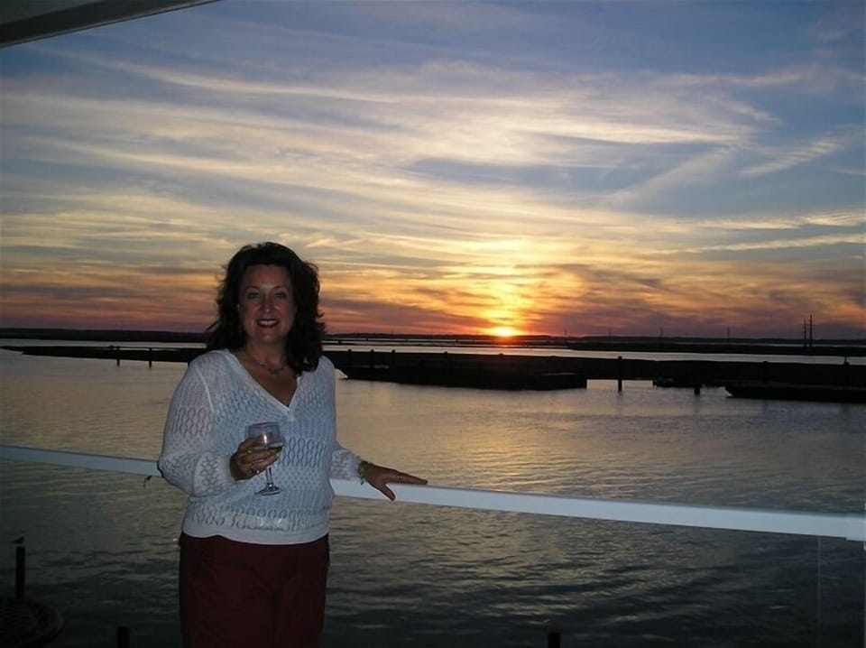 Beautiful May Sunset on private balcony and end unit at Sunset Bay Villas #219 