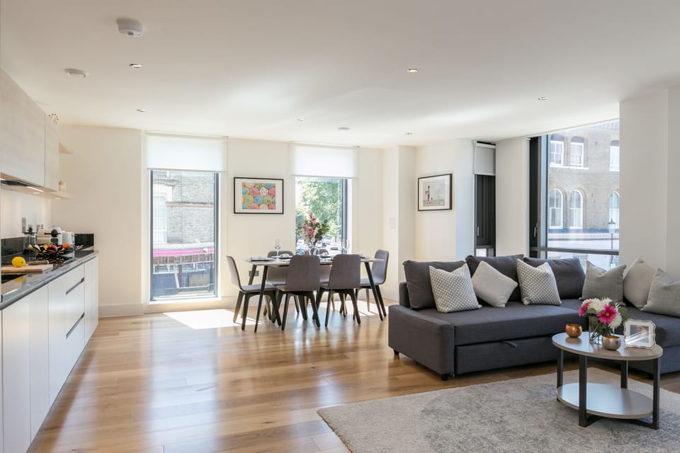 Deluxe Two Bedroom Apartment with Balcony | Living area | Flat-screen TV