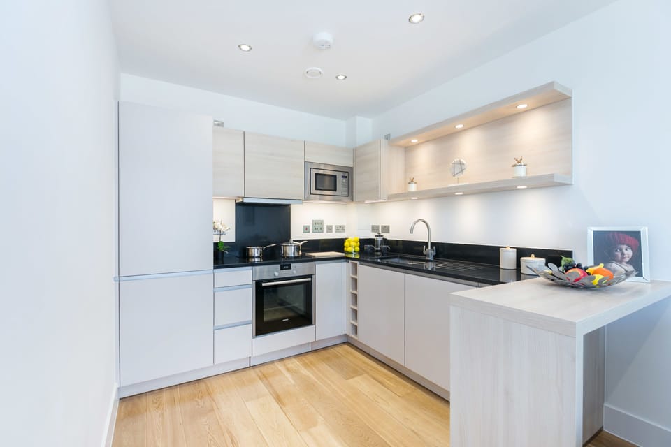 Deluxe One Bedroom Apartment with Balcony | Private kitchen | Coffee/tea maker, full-size fridge, microwave, oven