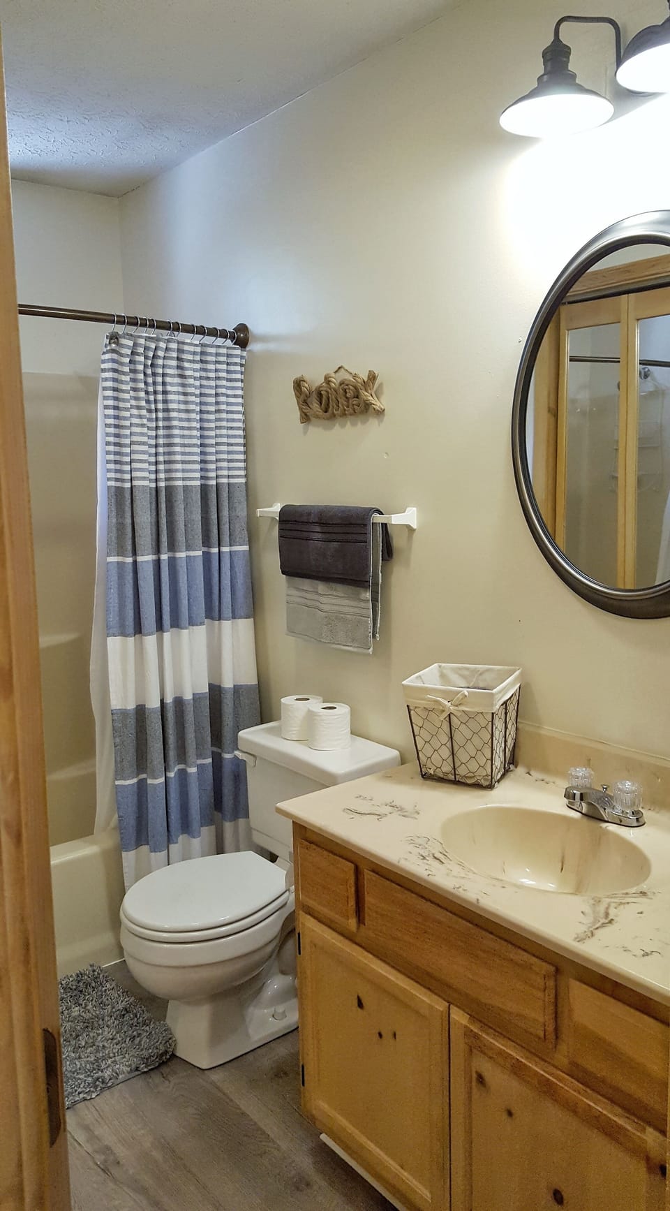Main Bath, brand new flooring, updated light fixture...