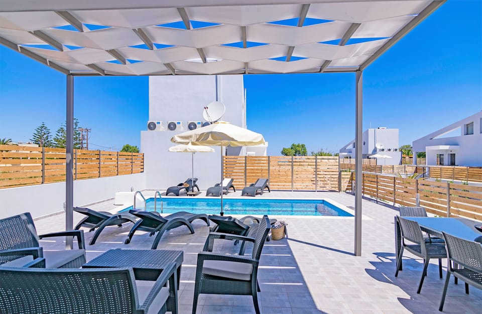 Blue oyster beach villas, Shaded pergola next to the swimming pool