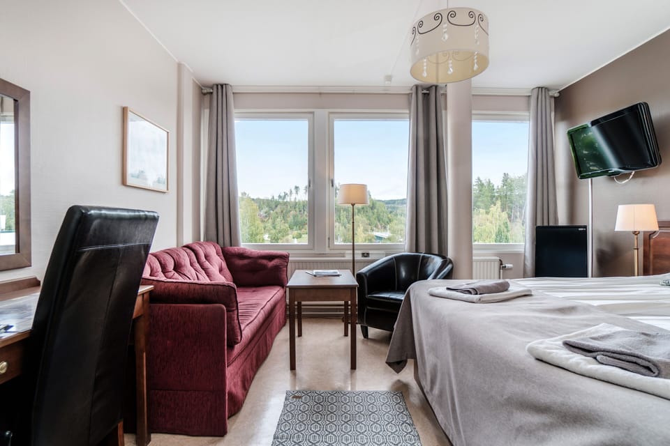 Double or Twin Room (with Sofa Bed) | Living area | Flat-screen TV