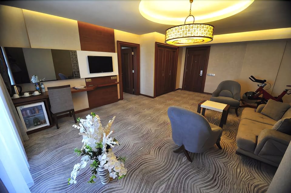 Family Suite, Smoking, City View | Living area | LCD TV