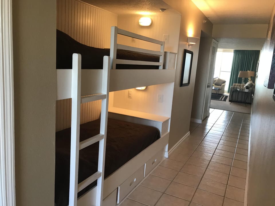 Built in bunk beds for space efficient sleeping with separate lights and outlets