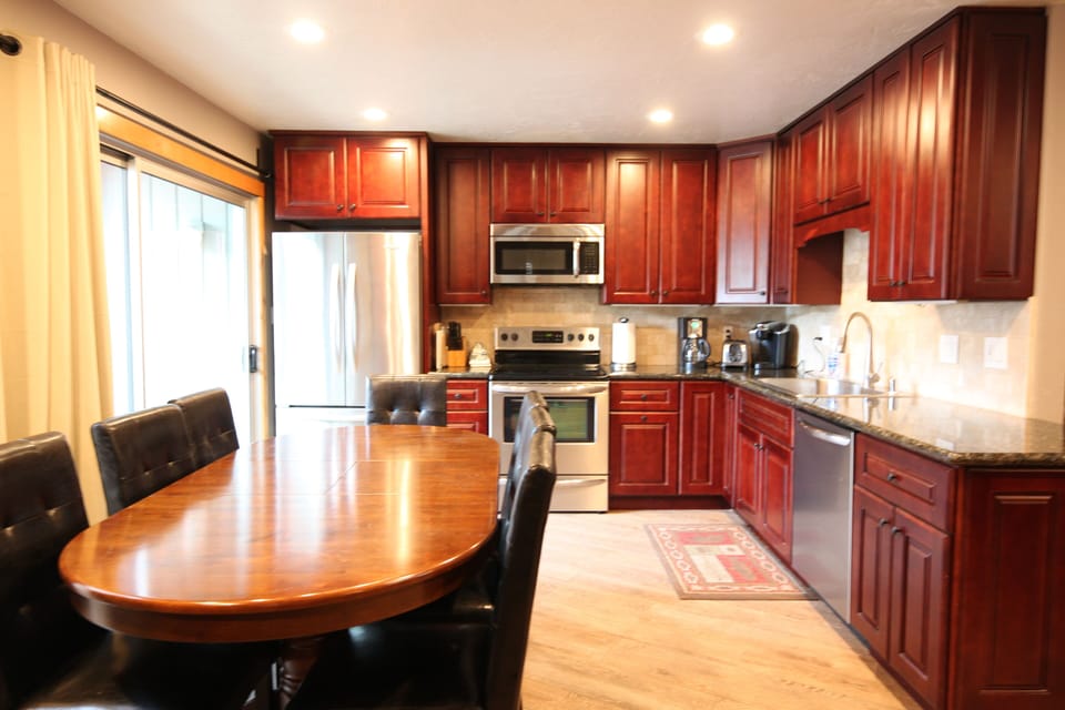 Sliding glass door on left leading to balcony