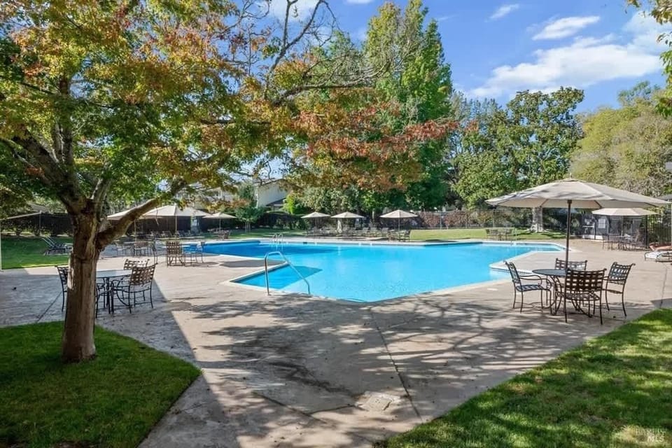 Indulge in poolside serenity at our Napa Valley retreat, offering a tranquil oasis surrounded by lush greenery.