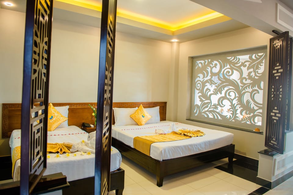 Family Beach Front Triple | Minibar, in-room safe, desk, laptop workspace