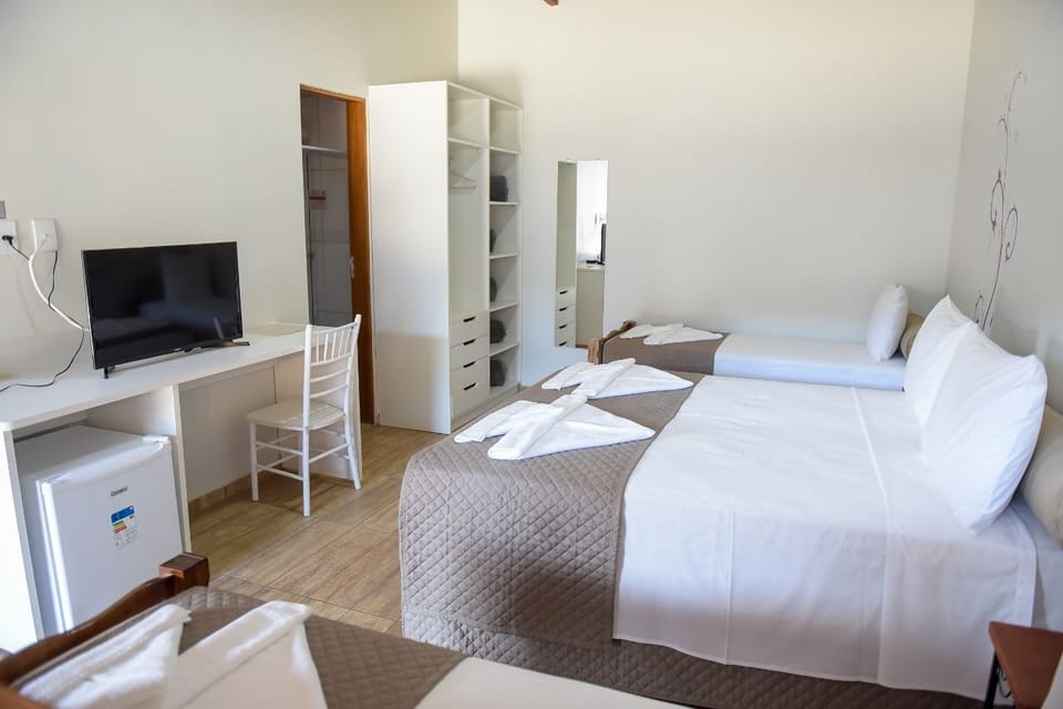 Basic Quadruple Room, 1 Bedroom | Minibar, in-room safe, desk, free WiFi