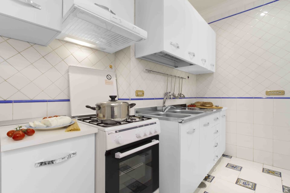 Apartment, 2 Bedrooms | Private kitchen | Fridge, microwave, stovetop, coffee/tea maker